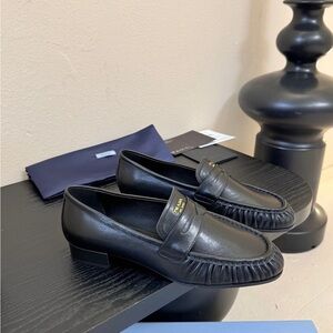 Prada Black Leather Loafers with Gold Accent
